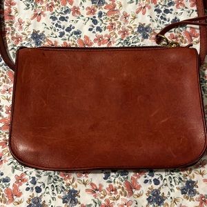 Pre loved Madewell crossbody bag in reddish burgundy color.